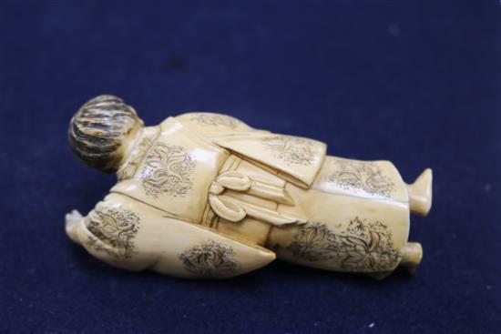 A Japanese ivory figure an ojime, a Chinese ivory figure and a plaque